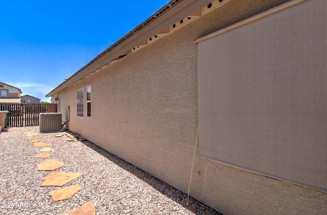 14298 W Amelia Ave, Goodyear, AZ 85395 - view of side of property featuring stucco siding, fence, and central air condition unit