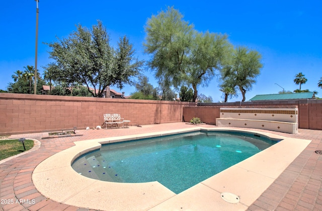 14298 W Amelia Ave, Goodyear, AZ 85395 - view of swimming pool with a fenced backyard and a patio area