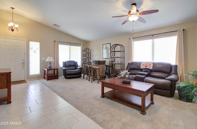 14298 W Amelia Ave, Goodyear, AZ 85395 - living area with vaulted ceiling, light carpet, a ceiling fan, and light tile patterned floors