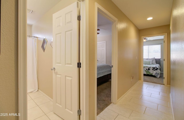 14298 W Amelia Ave, Goodyear, AZ 85395 - corridor with light tile patterned floors and baseboards