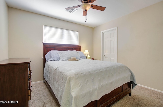 14298 W Amelia Ave, Goodyear, AZ 85395 - bedroom featuring carpet flooring, baseboards, and ceiling fan