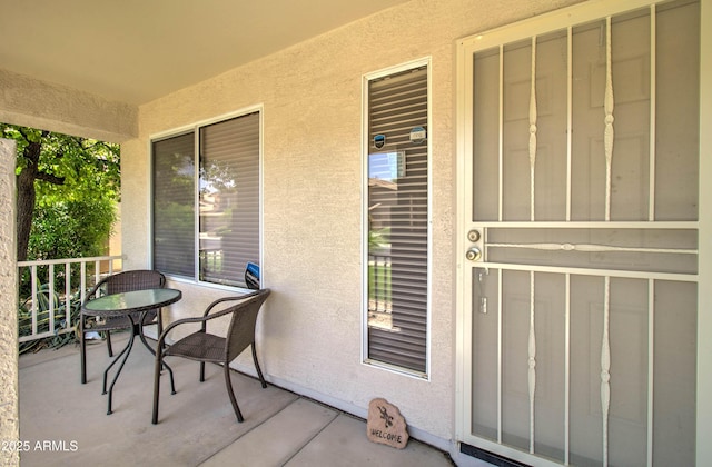14298 W Amelia Ave, Goodyear, AZ 85395 - doorway to property with a porch and stucco siding