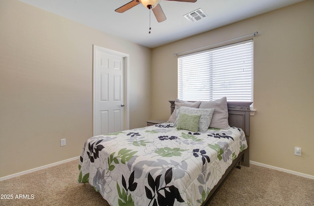 14298 W Amelia Ave, Goodyear, AZ 85395 - bedroom with carpet floors, baseboards, and a ceiling fan