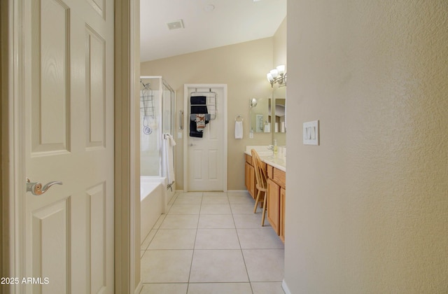 14298 W Amelia Ave, Goodyear, AZ 85395 - full bathroom featuring an enclosed shower, tile patterned flooring, a bath, vanity, and baseboards