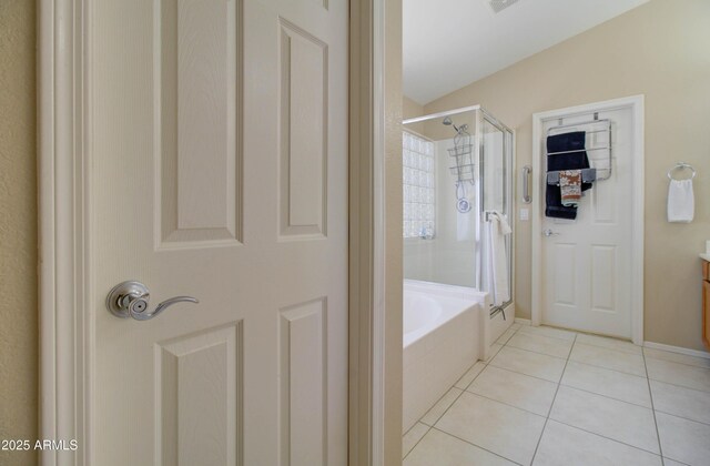 14298 W Amelia Ave, Goodyear, AZ 85395 - bathroom with a shower stall, tile patterned floors, a garden tub, and vanity