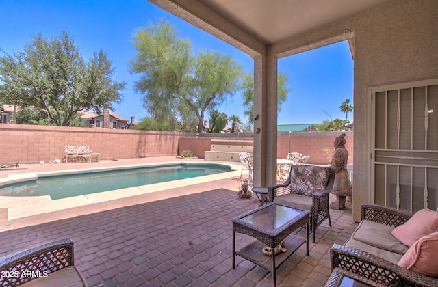 14298 W Amelia Ave, Goodyear, AZ 85395 - view of swimming pool with a patio area, a fenced backyard, and an outdoor hangout area
