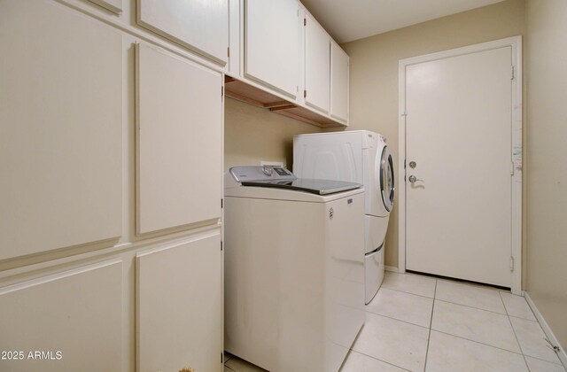 14298 W Amelia Ave, Goodyear, AZ 85395 - laundry area featuring cabinet space, independent washer and dryer, light tile patterned flooring, and baseboards