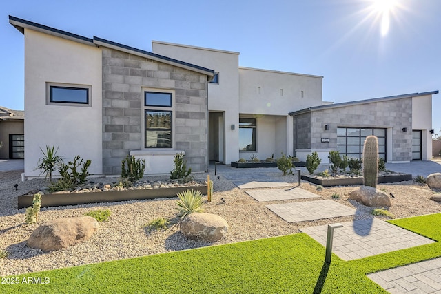 contemporary home featuring a patio area