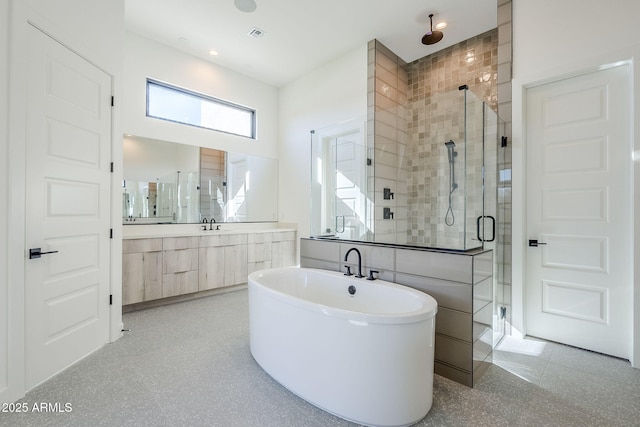 bathroom with vanity and independent shower and bath