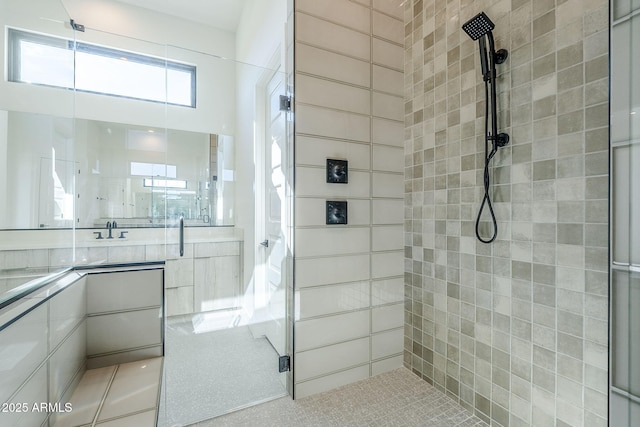 bathroom featuring walk in shower and tile patterned floors