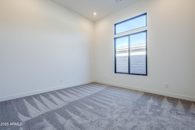 empty room featuring carpet flooring