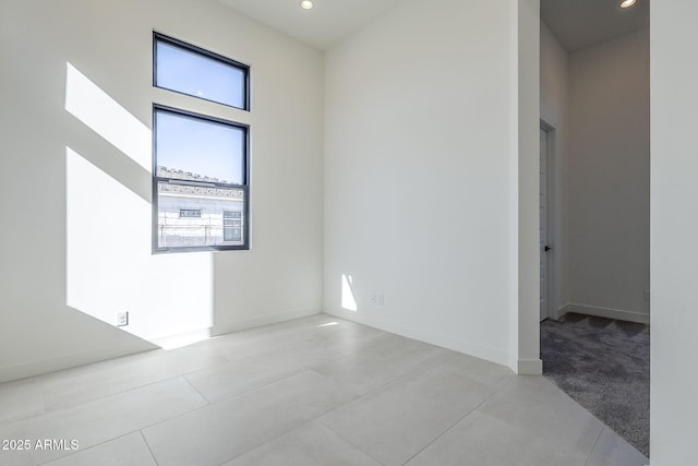 spare room featuring a high ceiling