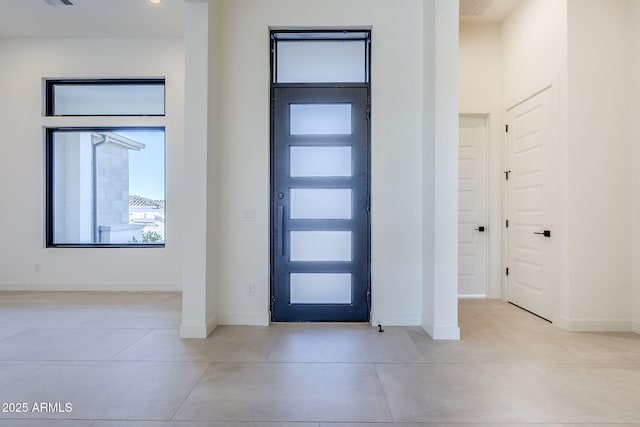 foyer with light tile patterned floors