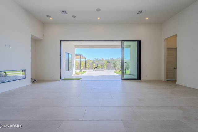 unfurnished room with light tile patterned floors