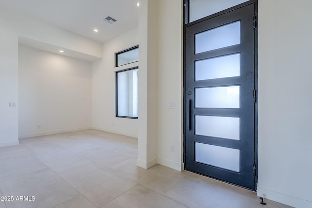 foyer entrance featuring light tile patterned floors