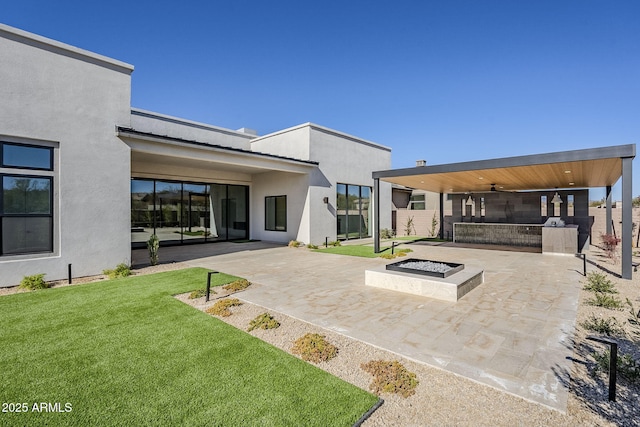 view of patio / terrace featuring an outdoor fire pit