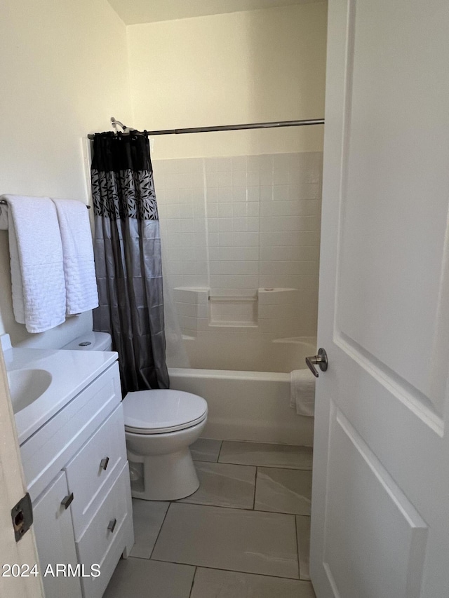 full bathroom with vanity, shower / tub combo with curtain, tile patterned floors, and toilet