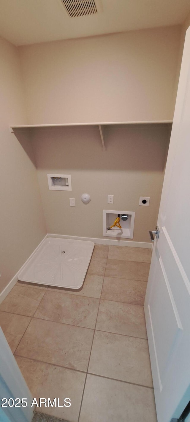 15593 S 180th Ln, Goodyear, AZ 85338 - laundry area with washer hookup, electric dryer hookup, hookup for a gas dryer, tile patterned flooring, and baseboards