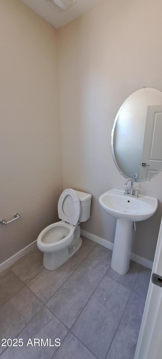 15593 S 180th Ln, Goodyear, AZ 85338 - half bath featuring toilet and tile patterned floors