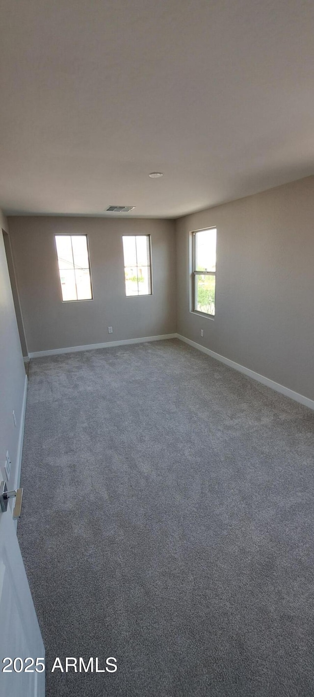 15593 S 180th Ln, Goodyear, AZ 85338 - unfurnished room with baseboards and carpet floors