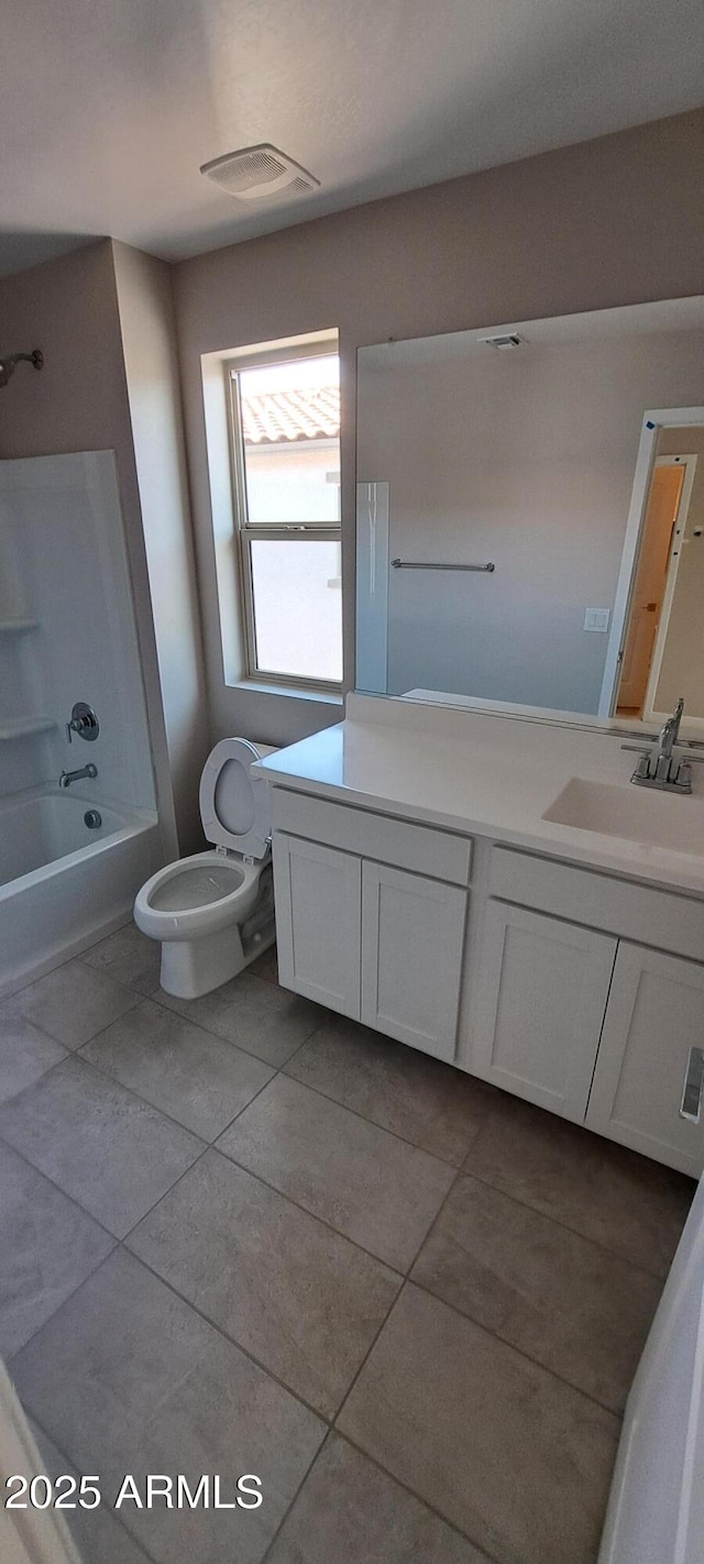 15593 S 180th Ln, Goodyear, AZ 85338 - full bath featuring toilet, vanity, tile patterned floors, and shower / washtub combination