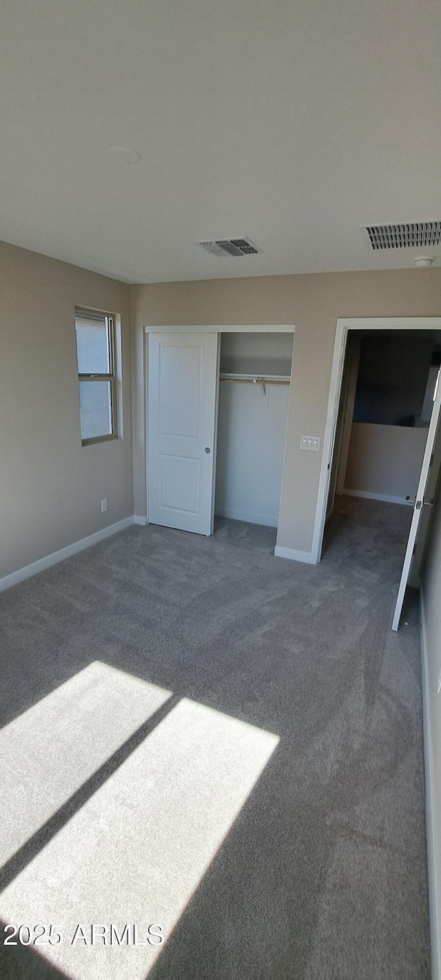 15593 S 180th Ln, Goodyear, AZ 85338 - unfurnished bedroom with carpet, baseboards, and a closet