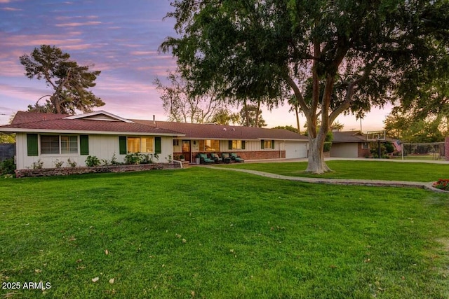 1831 E Rovey Ave, Phoenix, AZ 85016 - ranch-style house with a lawn