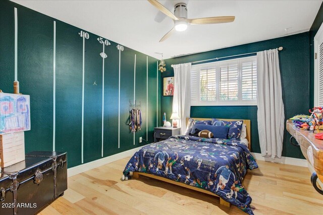 1831 E Rovey Ave, Phoenix, AZ 85016 - bedroom featuring wood finished floors and a ceiling fan