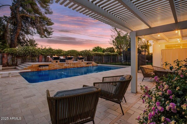 1831 E Rovey Ave, Phoenix, AZ 85016 - pool at dusk featuring a pergola, a patio area, and a fenced backyard