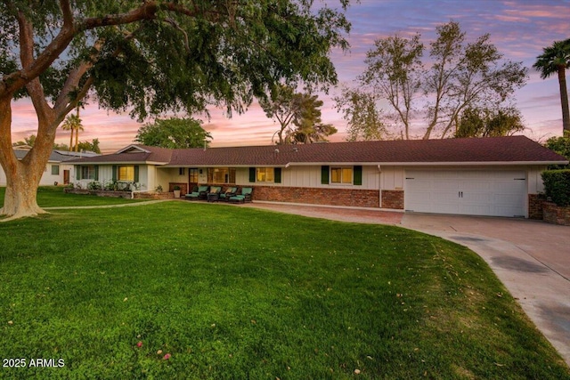 1831 E Rovey Ave, Phoenix, AZ 85016 - ranch-style house with an attached garage, concrete driveway, brick siding, and a front yard