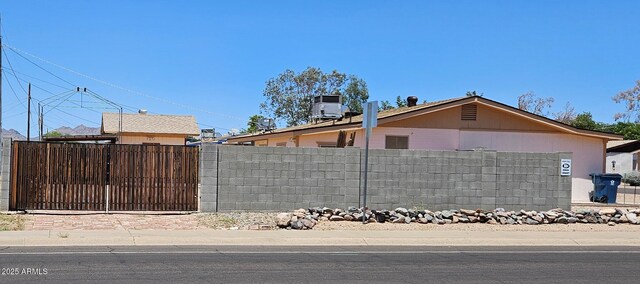 1586 S Lawther Dr, Apache Junction, AZ 85120 - view of property exterior with central air condition unit