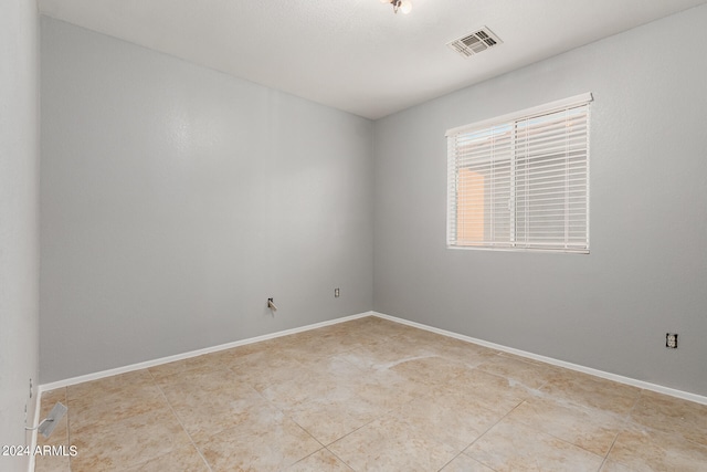 view of tiled spare room