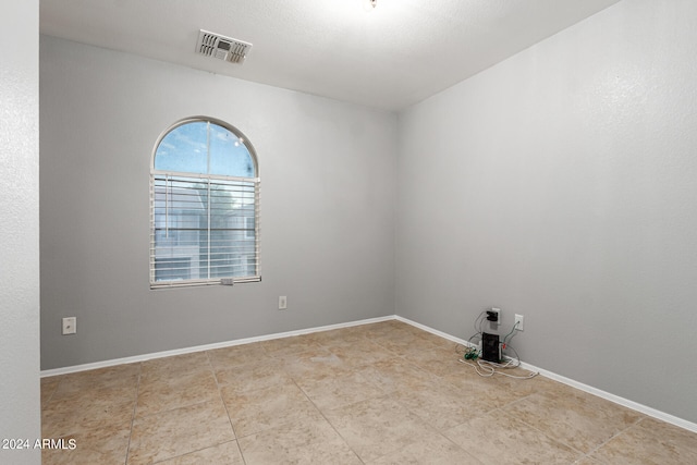 view of tiled spare room