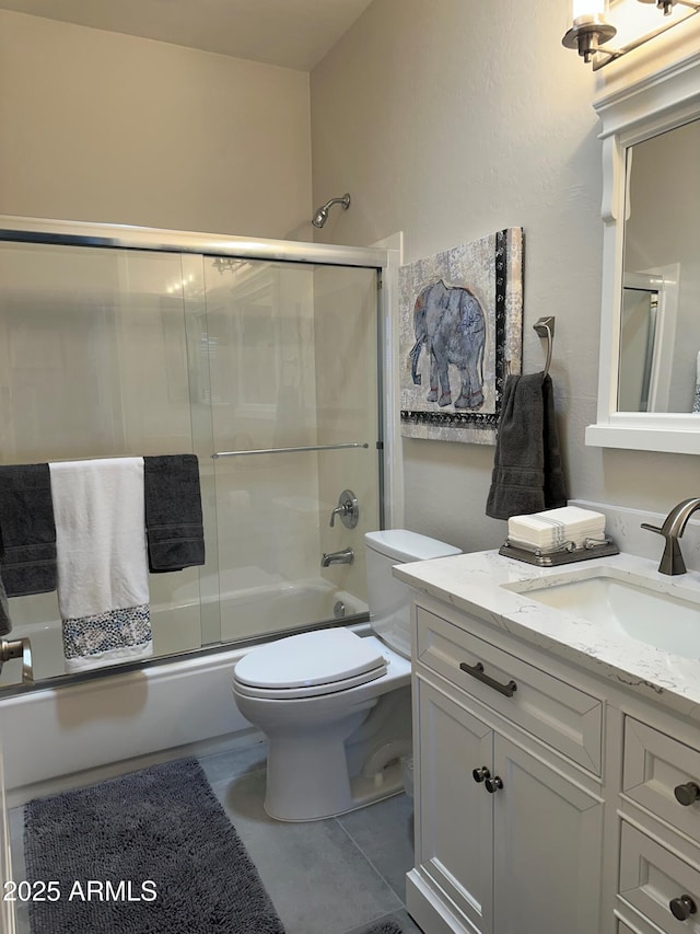 2013 E Valencia Dr, Phoenix, AZ 85042 - bathroom featuring vanity, shower / bath combination with glass door, and toilet
