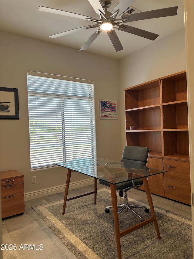 2013 E Valencia Dr, Phoenix, AZ 85042 - office area featuring a ceiling fan and baseboards