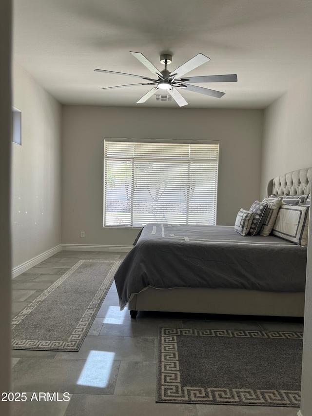 2013 E Valencia Dr, Phoenix, AZ 85042 - bedroom with ceiling fan and baseboards