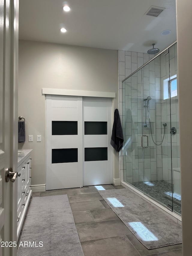 2013 E Valencia Dr, Phoenix, AZ 85042 - bathroom featuring a shower stall, vanity, recessed lighting, and baseboards