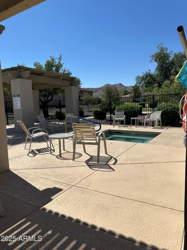 2013 E Valencia Dr, Phoenix, AZ 85042 - view of swimming pool featuring a mountain view, a patio area, and a pool