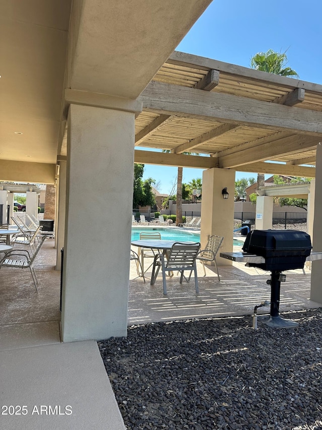 2013 E Valencia Dr, Phoenix, AZ 85042 - view of patio / terrace with a community pool and a grill