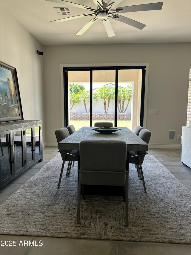 2013 E Valencia Dr, Phoenix, AZ 85042 - dining room featuring baseboards and ceiling fan