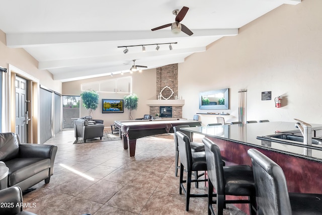 3825 E Camelback Rd Unit 182, Phoenix, AZ 85018 - playroom with ceiling fan, billiards, a fireplace, and tile patterned flooring