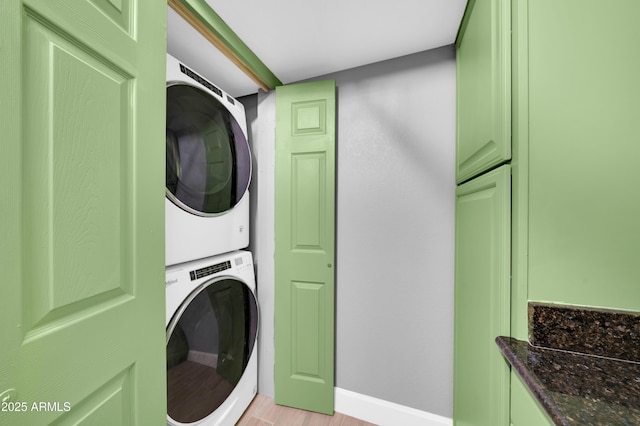 3825 E Camelback Rd Unit 182, Phoenix, AZ 85018 - laundry area with stacked washer and clothes dryer and light wood-style floors