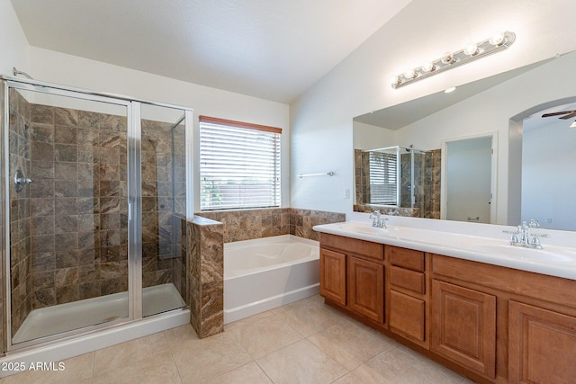 bathroom featuring lofted ceiling, shower with separate bathtub, tile patterned flooring, and vanity