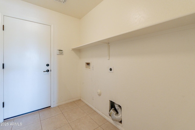 laundry area featuring light tile patterned flooring, hookup for an electric dryer, washer hookup, and gas dryer hookup