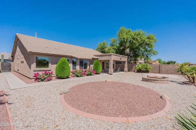 back of property with a patio