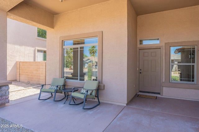 doorway to property with a patio area