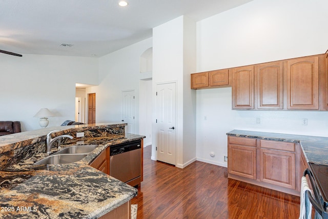 kitchen with sink, stainless steel appliances, dark hardwood / wood-style floors, and high vaulted ceiling