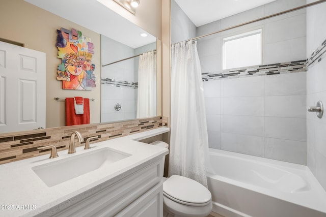 full bathroom featuring shower / tub combo with curtain, vanity, toilet, and decorative backsplash