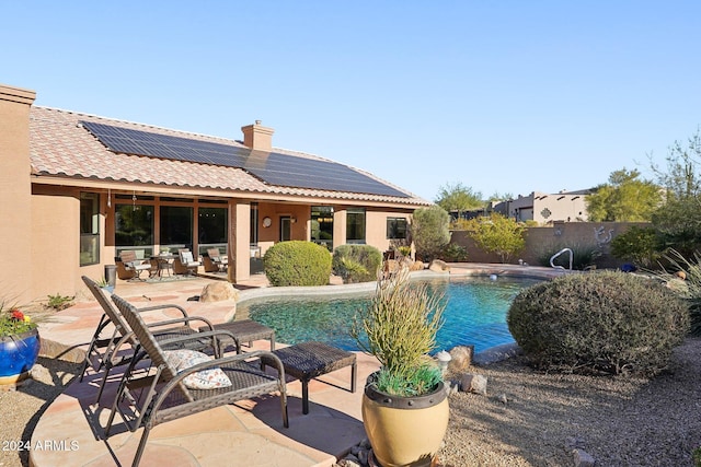 view of swimming pool with a patio