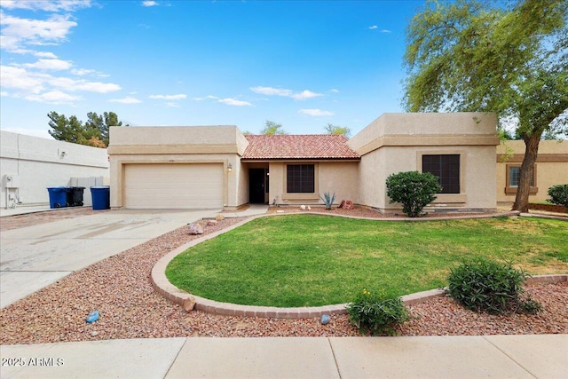 view of front of house with stucco siding, driveway, a front yard, a tile roof, and a garage